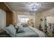 Bedroom with bright chandelier and access to office space at 654 S 83Rd Way, Mesa, AZ 85208