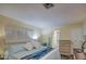 Bright bedroom features shuttered windows and soft, blue accents at 654 S 83Rd Way, Mesa, AZ 85208