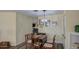 Traditional dining room featuring a wood table, ornate chandelier, and warm, inviting decor at 654 S 83Rd Way, Mesa, AZ 85208