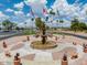 Attractive water fountain display with flags in a community center, enhancing the neighborhood's appeal at 654 S 83Rd Way, Mesa, AZ 85208