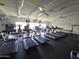 Brightly lit gym featuring modern treadmills, elliptical machines, and ceiling fans for a comfortable workout experience at 654 S 83Rd Way, Mesa, AZ 85208
