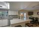 Bright kitchen featuring a large island, stainless steel appliances, and outdoor view at 654 S 83Rd Way, Mesa, AZ 85208