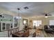 Open-concept living and dining area with modern lighting and stylish decor at 654 S 83Rd Way, Mesa, AZ 85208
