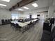 Well-lit meeting space with tables and chairs, perfect for gatherings and collaborative work at the club at 654 S 83Rd Way, Mesa, AZ 85208