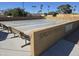 Outdoor shuffleboard court area with benches for players, perfect for leisurely games and community gatherings at 654 S 83Rd Way, Mesa, AZ 85208