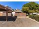 Exterior view of the home, showcasing the parking area and wooden fence around the property at 6604 W Kingston Ln, Glendale, AZ 85306