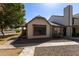 Charming single-Gathering home featuring desert landscaping and a welcoming covered entrance at 6604 W Kingston Ln, Glendale, AZ 85306