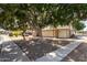 View of home with large shade tree and walkway at 6604 W Kingston Ln, Glendale, AZ 85306