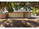 Front exterior of home showcasing mature tree with shade at 6604 W Kingston Ln, Glendale, AZ 85306
