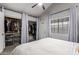 Bedroom with a ceiling fan and closet with modern sliding doors at 6604 W Kingston Ln, Glendale, AZ 85306