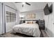 Bright main bedroom with a ceiling fan, neutral decor, and closet at 6604 W Kingston Ln, Glendale, AZ 85306