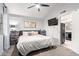 Main bedroom with a ceiling fan, neutral decor, and access to the kitchen at 6604 W Kingston Ln, Glendale, AZ 85306