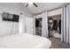 Bedroom with a ceiling fan and a closet with sliding doors at 6604 W Kingston Ln, Glendale, AZ 85306
