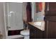 Bathroom with a shower-tub combination, toilet, sink and dark cabinets at 7807 E Main St # D-32, Mesa, AZ 85207