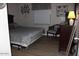 Bedroom showcasing a bed, chair, dresser, and contemporary decor at 7807 E Main St # D-32, Mesa, AZ 85207