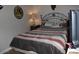 Bedroom showcasing a comfortable bed with stylish bedding and western-themed decorations at 7807 E Main St # D-32, Mesa, AZ 85207
