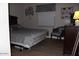 This is a cozy bedroom with a large bed, side table, and soft lighting for a restful retreat at 7807 E Main St # D-32, Mesa, AZ 85207