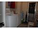 Laundry room with a washing machine, dryer, storage and a window at 7807 E Main St # D-32, Mesa, AZ 85207