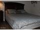 Cozy main bedroom with a large bed, side table, and soft lighting for a restful retreat at 7807 E Main St # D-32, Mesa, AZ 85207