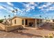 Backyard with patio, gravel landscape, and views of palm trees at 8103 E Southern Ave # 119, Mesa, AZ 85209