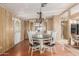 Bright dining area with traditional chandelier, built-in storage, and seating for four at 8103 E Southern Ave # 119, Mesa, AZ 85209