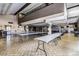 Large event space featuring high ceilings, long tables, wood floors, and ample lighting at 8103 E Southern Ave # 119, Mesa, AZ 85209