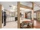 Functional kitchen with tiled backsplash, updated appliances, and breakfast bar overlooking living area at 8103 E Southern Ave # 119, Mesa, AZ 85209