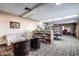 Cozy library featuring bookshelves filled with books, comfortable seating, and carpeted flooring at 8103 E Southern Ave # 119, Mesa, AZ 85209