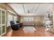 Spacious living room with wood-look floors, neutral tones, and comfortable seating arrangement at 8103 E Southern Ave # 119, Mesa, AZ 85209