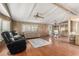 Open-concept living area with ample natural light, ceiling fan, and seamless flow to dining area at 8103 E Southern Ave # 119, Mesa, AZ 85209