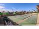 Outdoor shuffleboard court with benches, palm trees, and RVs in the background on a sunny day at 8103 E Southern Ave # 119, Mesa, AZ 85209