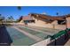 Outdoor shuffleboard court surrounded by palm trees, with a modern building in the background at 8103 E Southern Ave # 119, Mesa, AZ 85209