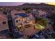 This aerial view showcases a backyard with a pool, hot tub, patio, and outdoor kitchen at 8362 W Rosewood Ln, Peoria, AZ 85383