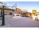 This backyard is a perfect place to relax with its gazebo, outdoor fireplace, and basketball court at 8362 W Rosewood Ln, Peoria, AZ 85383