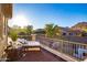 Balcony view featuring daybed, railing, and mountain views in the background at 8362 W Rosewood Ln, Peoria, AZ 85383