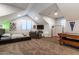 Bonus room with carpeted floor, air hockey table, and gray sofa at 8362 W Rosewood Ln, Peoria, AZ 85383