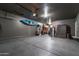 Large garage with epoxy flooring offering plenty of space for storage and hobbies at 8362 W Rosewood Ln, Peoria, AZ 85383
