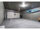 Spacious garage features epoxy floors, ample storage, and a convenient electric vehicle charging station at 8362 W Rosewood Ln, Peoria, AZ 85383