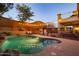 Beautiful backyard pool with poolside lounge chairs, gazebo, and string lights for evening relaxation at 8362 W Rosewood Ln, Peoria, AZ 85383
