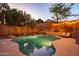 Sparkling pool with surrounding greenery creating a serene backyard oasis at 8362 W Rosewood Ln, Peoria, AZ 85383