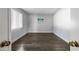 A bright bedroom with wood floors and fresh white paint with a window view of the outdoors at 8742 E Via De La Luna --, Scottsdale, AZ 85258