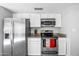 Well-lit kitchen featuring stainless steel appliances, granite countertops and white cabinetry at 8742 E Via De La Luna --, Scottsdale, AZ 85258