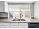 Close up of a kitchen sink with granite countertops and bright lighting at 8742 E Via De La Luna --, Scottsdale, AZ 85258