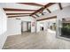Open-concept living space with vaulted ceilings, beams, and plenty of natural light at 8742 E Via De La Luna --, Scottsdale, AZ 85258