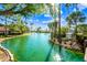 Tranquil pond surrounded by trees and well-manicured lawns in the community at 8742 E Via De La Luna --, Scottsdale, AZ 85258