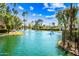 Inviting community pond with swaying palm trees and well-maintained landscaping at 8742 E Via De La Luna --, Scottsdale, AZ 85258