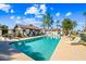 Community pool with sun loungers and patio seating surrounded by lush landscaping at 8742 E Via De La Luna --, Scottsdale, AZ 85258