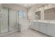 Bright bathroom featuring double sinks, soaking tub, and glass enclosed shower at 896 E Indian Wells Pl, Chandler, AZ 85249