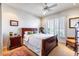 Comfortable bedroom features a ceiling fan, plantation shutters, and neutral tones at 9671 E Cavalry Dr, Scottsdale, AZ 85262