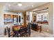 Open-concept kitchen featuring a breakfast bar and views into the adjacent living spaces at 9671 E Cavalry Dr, Scottsdale, AZ 85262